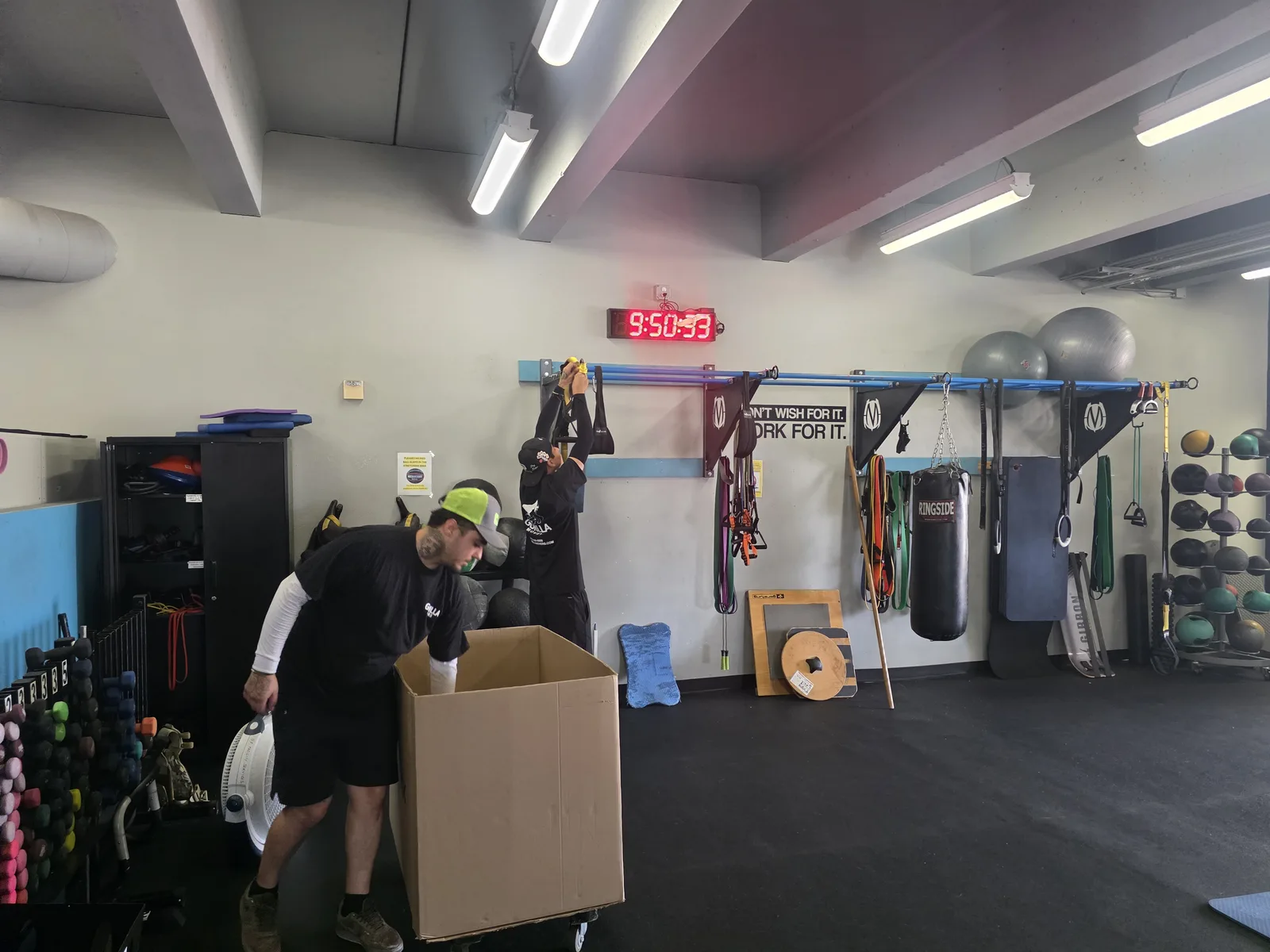 Gorilla Movers crew wrapping treadmill for gym relocation in La Jolla