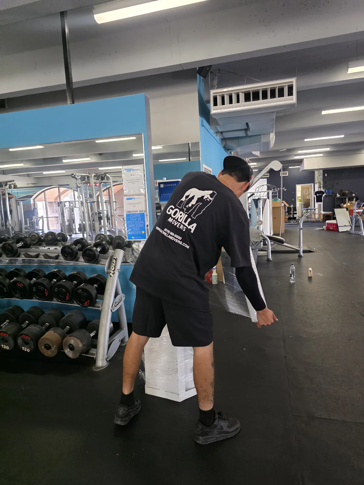Gorilla Movers team moving stationary bike in La Jolla