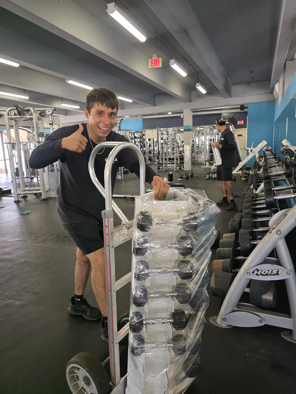 Gorilla Movers loading smith machine onto dolly in La Jolla