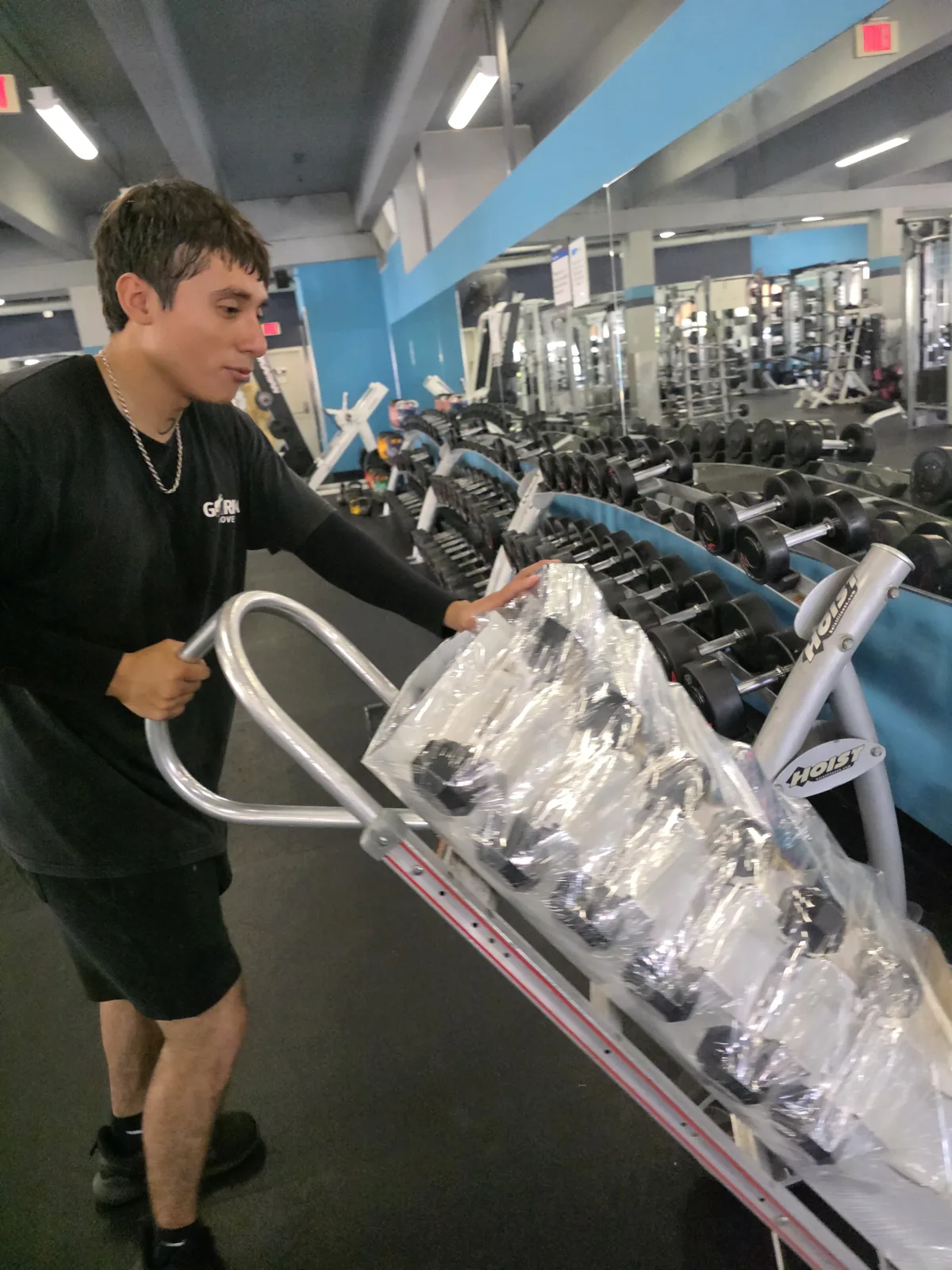 Gorilla Movers securing rowing machine for transport in La Jolla