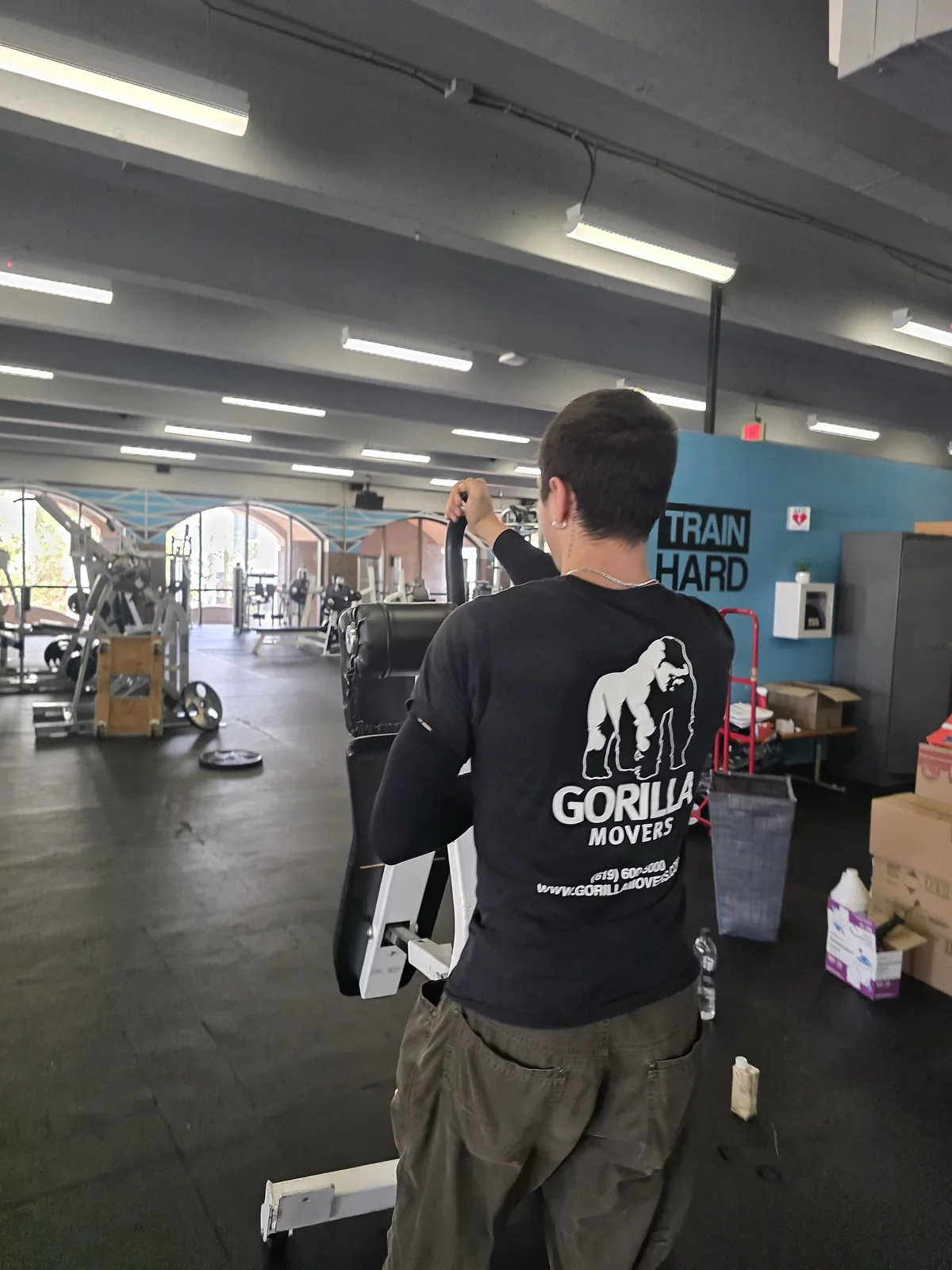 Gorilla Movers reassembling multi-station gym system in La Jolla