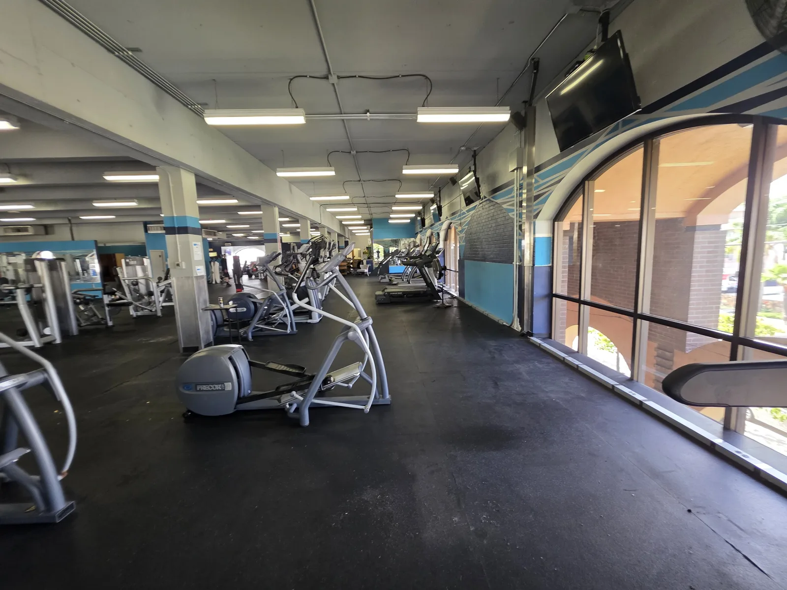 Gorilla Movers team installing mirrors in La Jolla gym