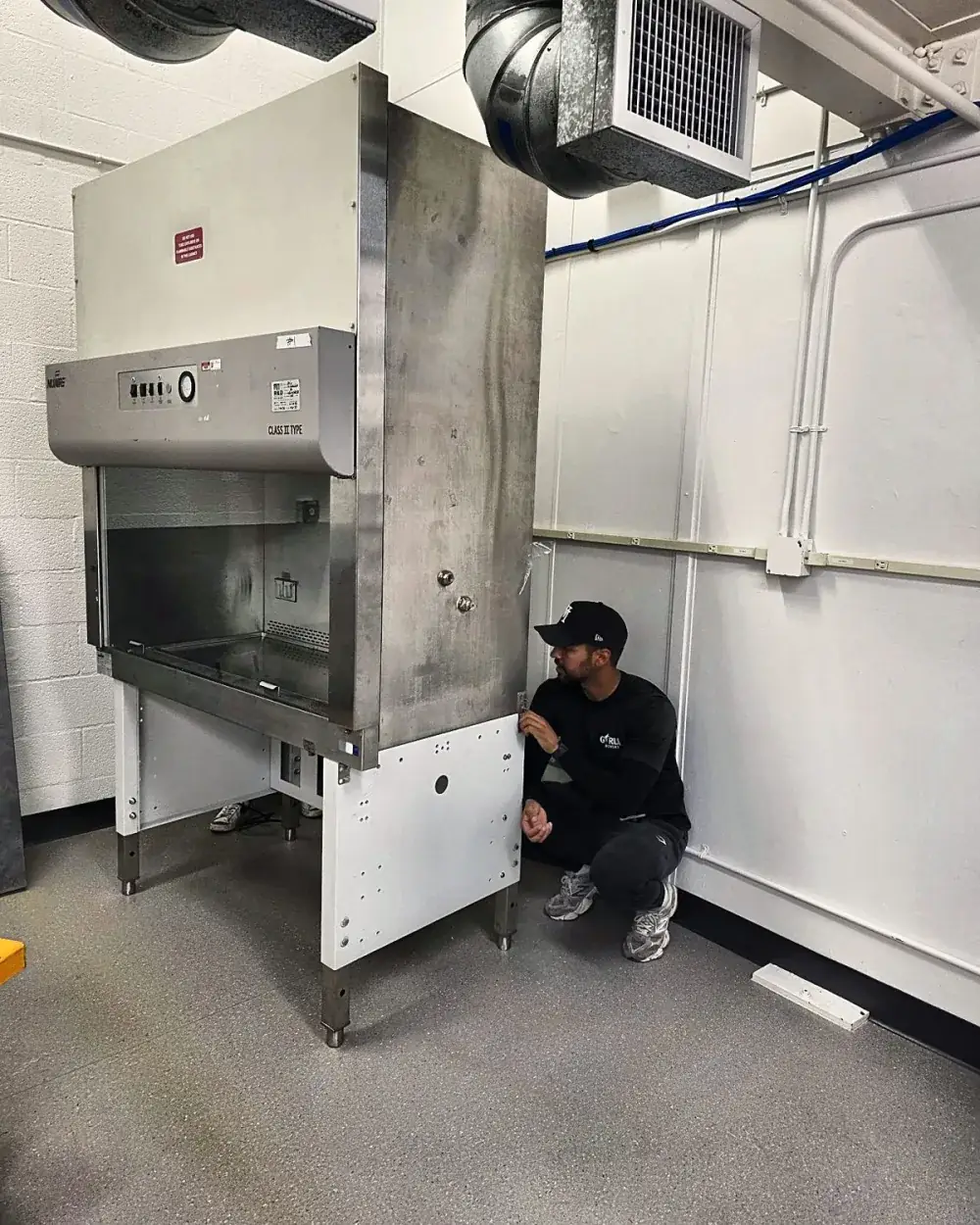 Leveling a biosafety cabinet at its final location