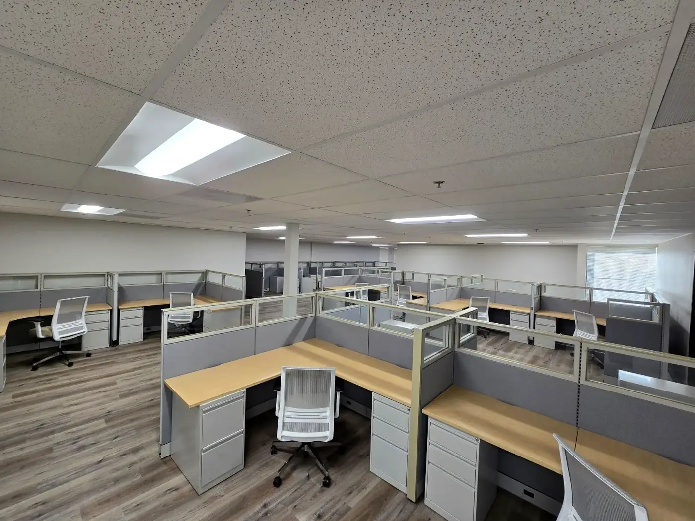 Cubicle workstations with new chairs after an FF&E installation by Gorilla Movers in San Diego