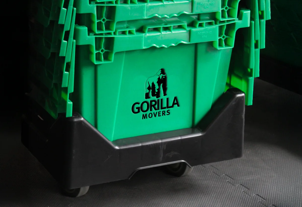 Branded Gorilla Movers reusable green employee moving crate on a dolly