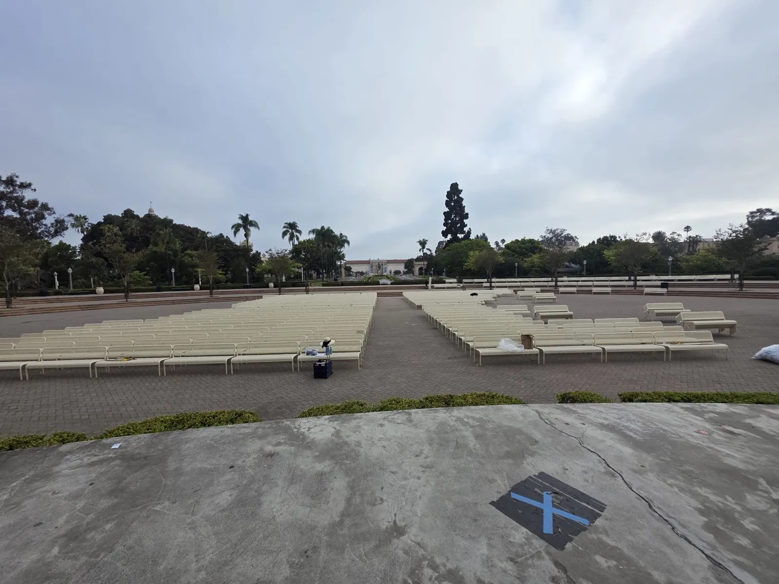 Benches lined up across the organ pavilion plaza in Balboa Park