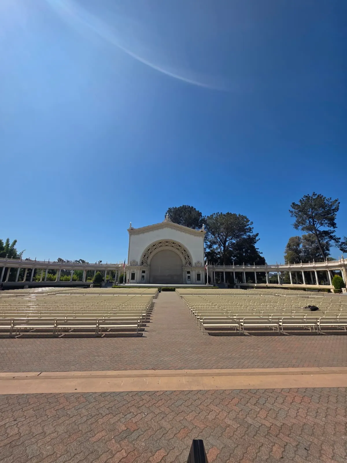 A Gorilla Movers mover carrying a bench at the Spreckels Organ Pavilion