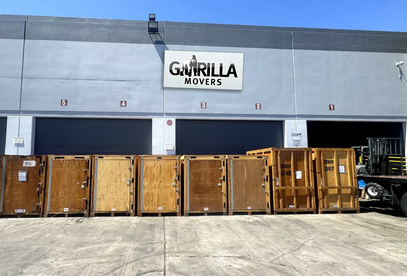 Loading dock outside the Gorilla Movers Miramar storage warehouse with wooden storage vaults staged for pickup and delivery in San Diego