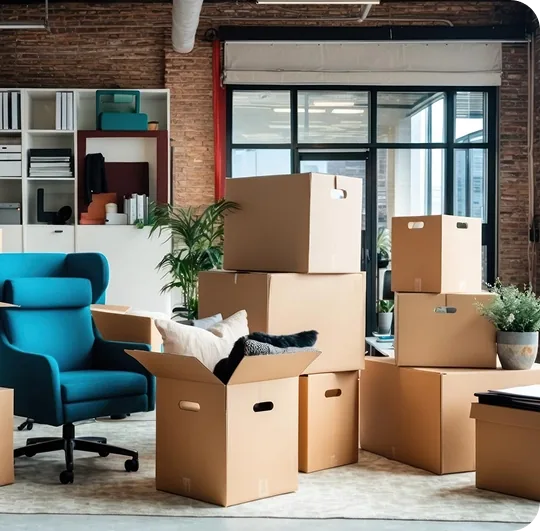 Office chair and packed boxes during a workstation teardown