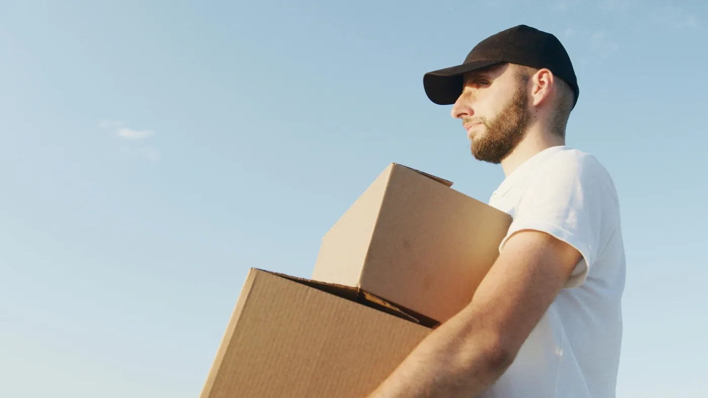 Mover carefully carrying a box during a senior move